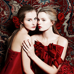 Fashion shoot with two models with Red Naomi roses