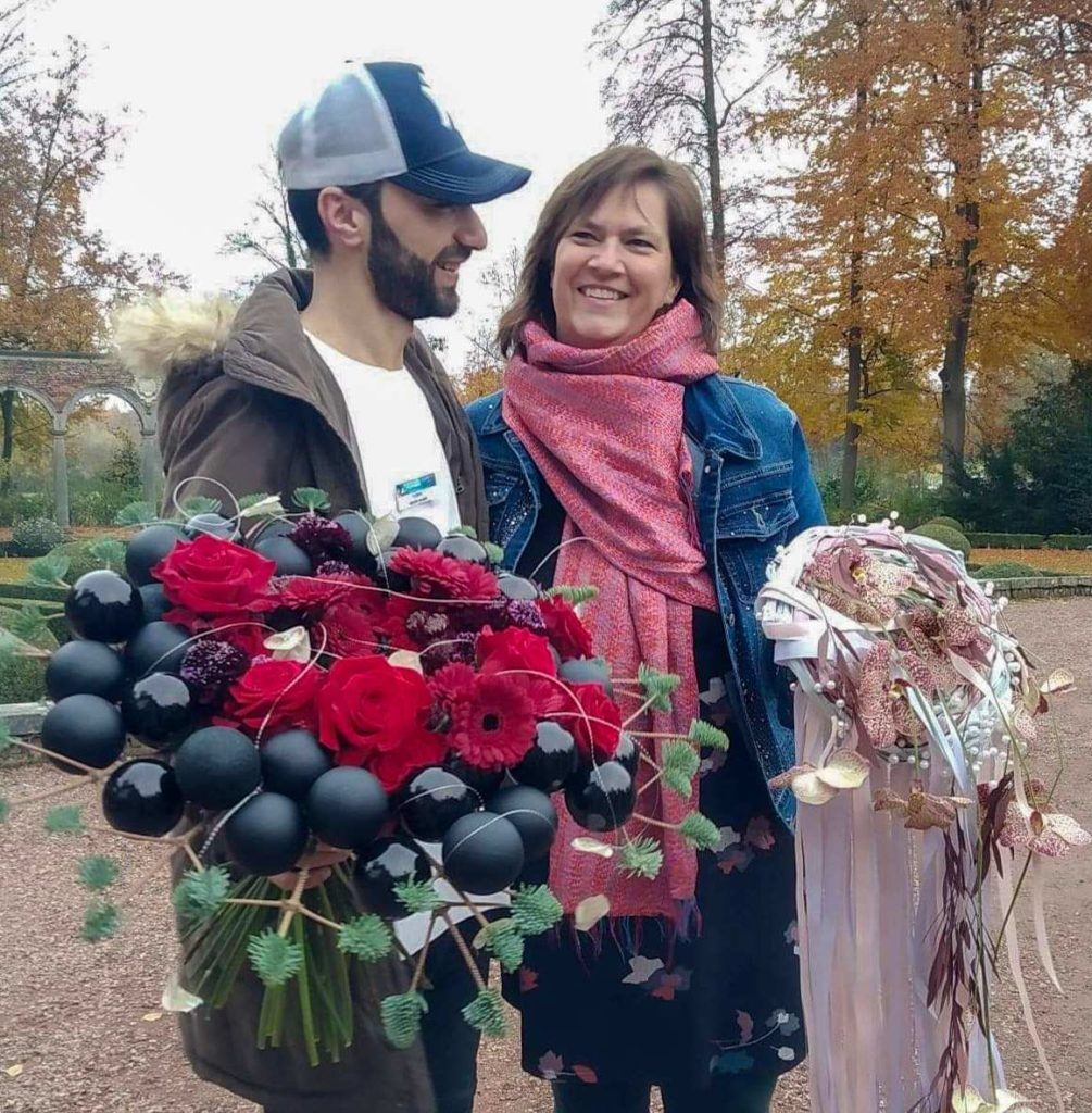 Mehdi Sharif with Regine Motmans porta nova red naomi bouquet